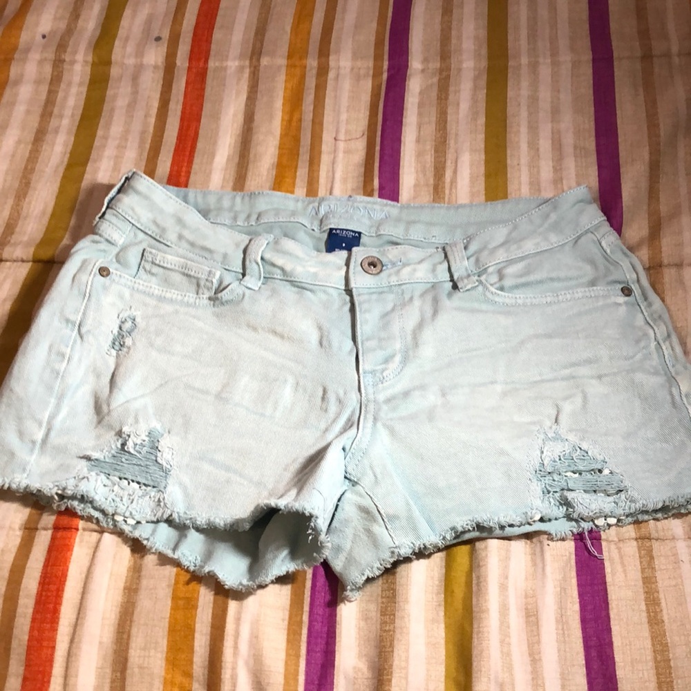 Light blue denim jeans with cutouts